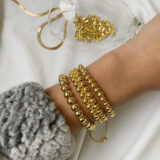 Pulsera balines dorada acero